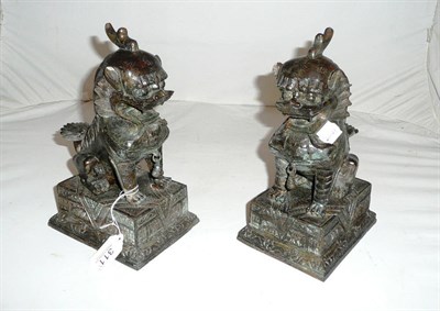 Lot 311 - A pair of Chinese bronze dogs of fo