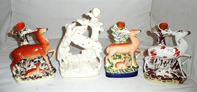 Lot 312 - Four Staffordshire figure groups of deer