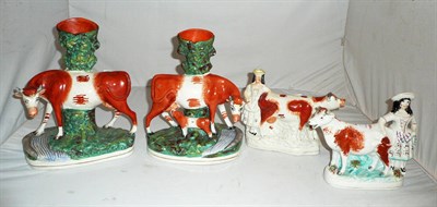 Lot 313 - Two pairs of Staffordshire figures of cows