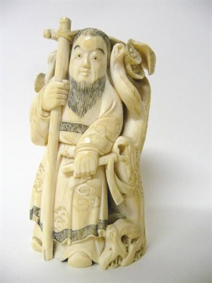 Lot 182 - A Japanese Carved Elephant Ivory Okimono, Meiji Period (1868-1912), fashioned from a single...