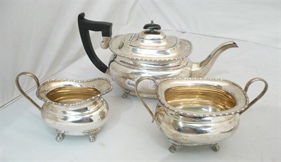 Lot 324 - A silver three piece tea set, London 1935