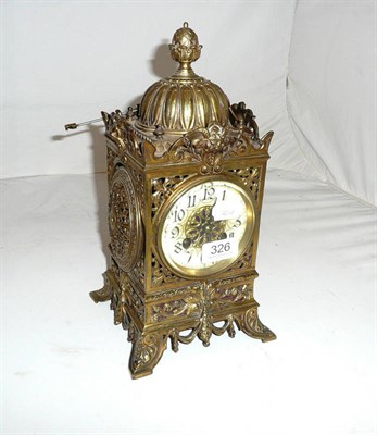 Lot 326 - Pierced brass mantel clock with pendulum and key