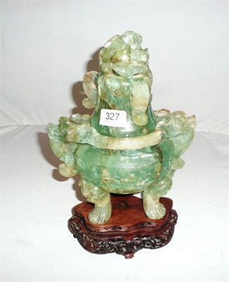 Lot 327 - A Chinese green quartz two-handled koro and cover and pierced wood stand