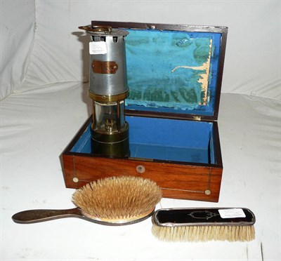 Lot 350 - Hinged jewellery box and a miners lamp, and two tortoiseshell and silver mounted brushes