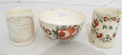 Lot 364 - 18th century creamware bowl, creamware mug initialled RB and a creamware mug with verse (3)