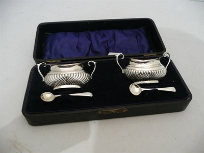 Lot 373 - A cased pair of silver salts and associated spoons