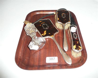 Lot 387 - Silver and tortoiseshell dressing table pieces and a perfume bottle