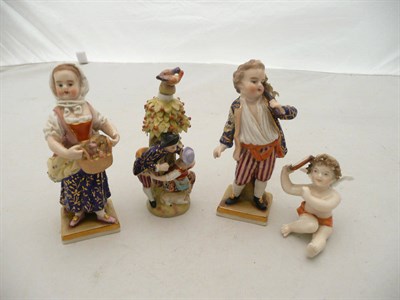 Lot 453 - German figural scent bottle of a kissing couple, pair of figures and a seated cherub (4)