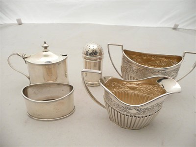 Lot 456 - A silver sugar and cream and a three piece cruet