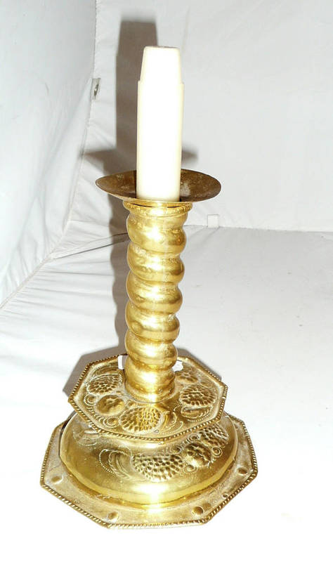 Lot 495 - 17th century brass candlestick