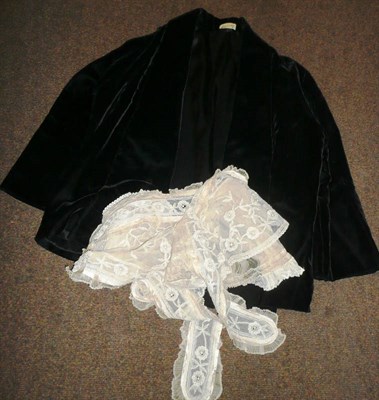 Lot 500 - A Harrods black velvet women's evening jacket and two lace mounted aprons