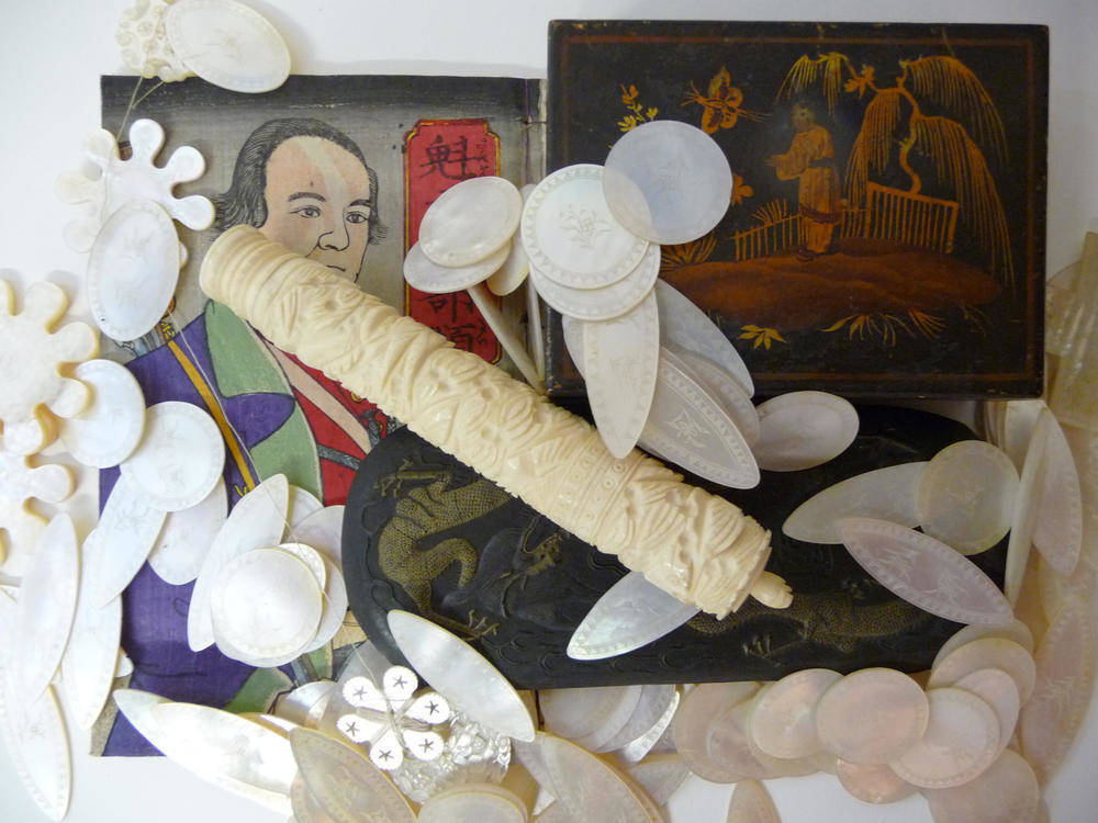 Lot 201 - A Chinese Ink Cake, late 19th century, of flattened oval shape, cast in relief with two sky dragons