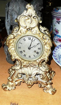 Lot 524 - Rococo style brass mantel clock