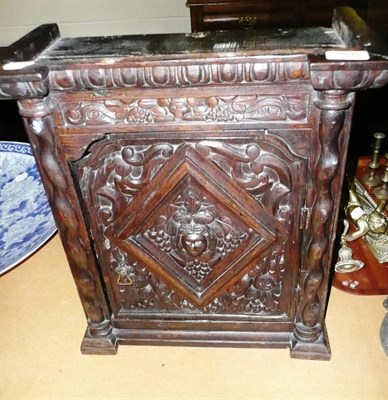 Lot 526 - Small stained carved wall cupboard