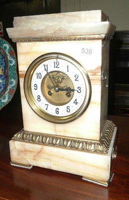 Lot 538 - An onyx striking mantel clock retailed by Maple & Co, Paris