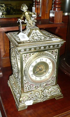 Lot 540 - Pierced brass mantel clock with cherub surmount