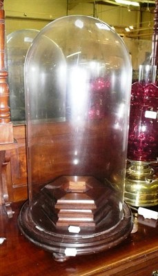 Lot 541 - A Victorian glass dome on a mahogany base