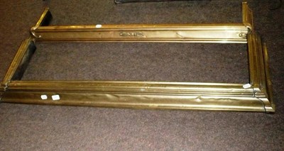 Lot 545 - Four brass fenders