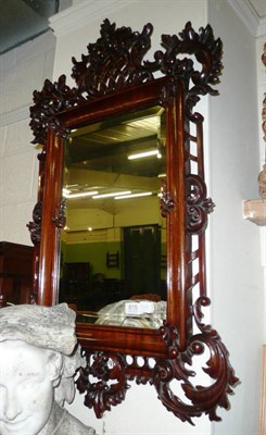 Lot 615 - Carved mahogany wall mirror