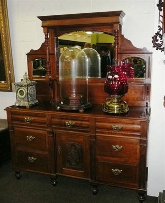 Lot 617 - A walnut mirror back sideboard