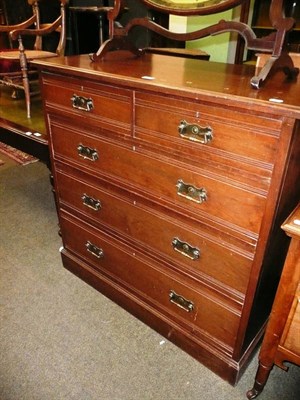 Lot 643 - An Edwardian walnut four height chest of drawers