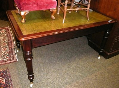 Lot 645 - Mahogany desk/table on castors with two drawers at one end