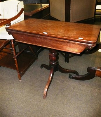 Lot 646 - A 19th century oak fold over tea table