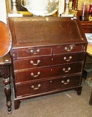 Lot 678 - A Georgian mahogany bureau