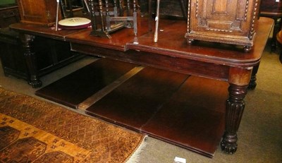 Lot 717 - A large Victorian mahogany extending dining table with extra leaves