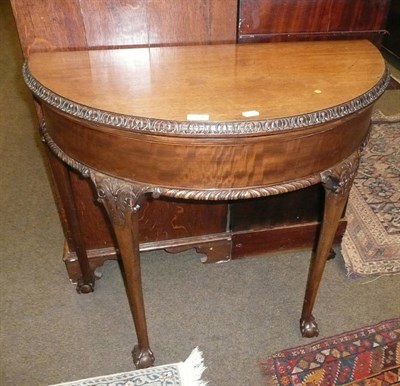 Lot 724 - Mahogany fold-over card table