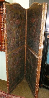 Lot 752 - An embossed and painted three fold leather screen