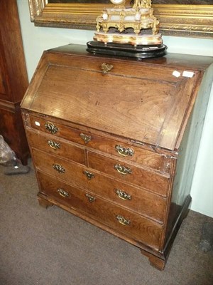 Lot 768 - 19th century oak bureau