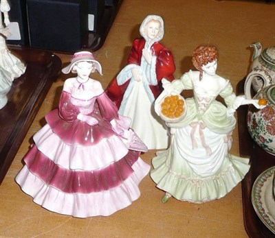 Lot 29 - Two Coalport figures "Ladies of Fashion Daphne" and "Nell Gwynn" and a Royal Doulton figure...