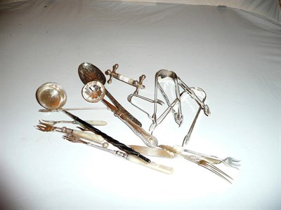 Lot 45 - Silver sugar tongs, including Newcastle assay, silver pickle fork and other silver and plated...
