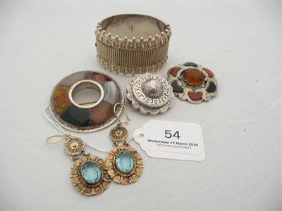 Lot 54 - Two Scottish hardstone brooches, a silver target brooch, a silver bangle and a pair of silver...