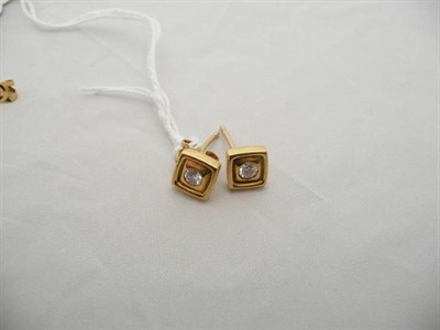 Lot 65 - A pair of 18 carat gold diamond earrings