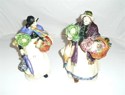 Lot 83 - Two slip case pottery figures in the manner of Charles Vyse (some damage)