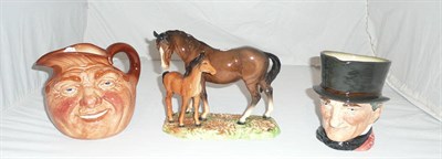 Lot 150 - A Beswick mare and foal figure group and two Royal Doulton large pottery character jugs - 'John...