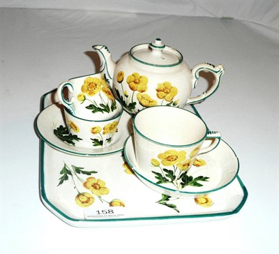 Lot 158 - Wemyss Breakfast teaset for one, painted with buttercups, including teapot and cover, cup and...