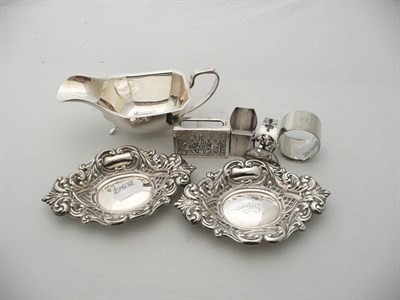 Lot 193 - Silver sauce boat, pair of silver pierced dishes, silver napkin ring, two plated napkin rings and a