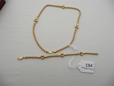 Lot 194 - A bracelet and necklace set, stamped '750', 24.7g approx.