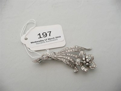 Lot 197 - A diamond-set floral spray brooch (one stone missing)