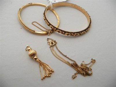 Lot 219 - A fancy bangle stamped '15CT', another bangle and a 9 carat tassel pendant with chain