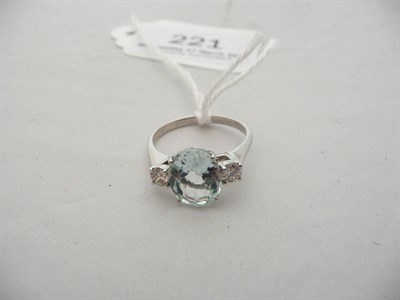 Lot 221 - A 14 carat white gold aquamarine and diamond three stone ring