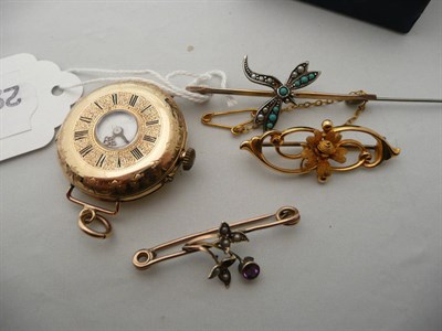 Lot 223 - A seed pearl set engraved lady's fob watch, a filigree brooch, and two others (a.f)