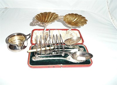 Lot 243 - A pair of cased silver spoons, Sheffield 1896, a silver toast rack, Sheffield 1904, a silver...