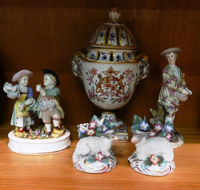 Lot 269 - A French vase and cover, a pair of Continental sheep, German figure and a Continental group (5)