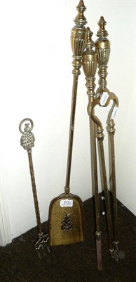 Lot 272 - Three brass fire irons and a toasting fork