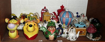 Lot 289 - Shelf of sixteen novelty teapots