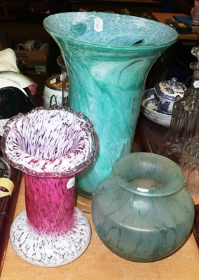 Lot 306 - A pink and white glass vase, and green glass vase and another